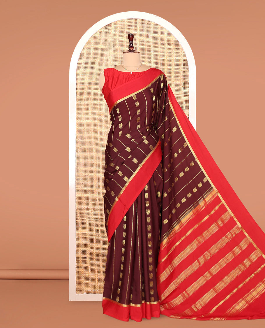 Brown Mysore Silk Saree, Ornamented With Zari Stripes and Peacock Buttas Across Its Body, Complemented by Captivating Contrast Border of Traditional Zari Designs, Pallu Steeped with Traditional Zari Designs, and Paired with a Contrast Blouse