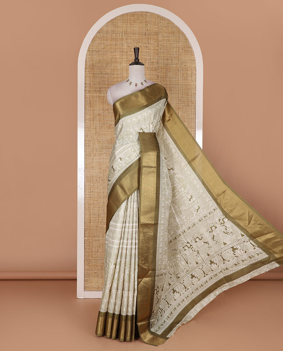 Cream and green Madhubani village theme characters printed soft tussar saree, contrast traditional zari border, Madhubani printed pallu, and a matching blouse