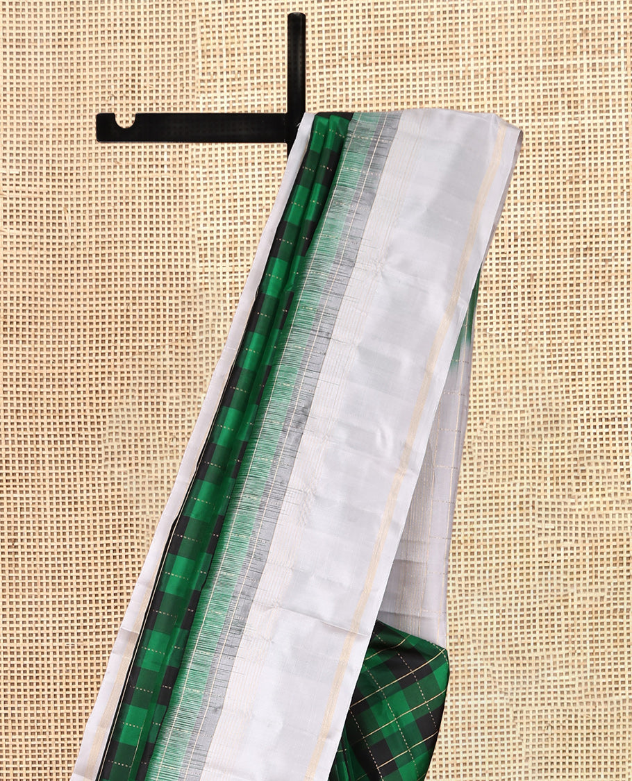 Green Checked Kanchipuram Silk Saree, Complemented by a Contrast Border of Zari Stripes, Zari Checked Pallu, and a Contrast Blouse