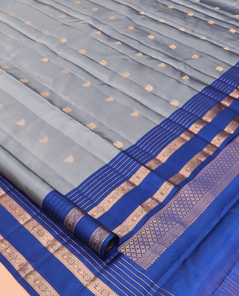 Grey Vasundhara Lite Silk Mix Saree, Ornamented with Zari Buttas, a Contrast Rettai Pettu Border of Rekku, Muthu, Diamond, and Manga Designs, Manga Pallu, and a Contrast Blouse