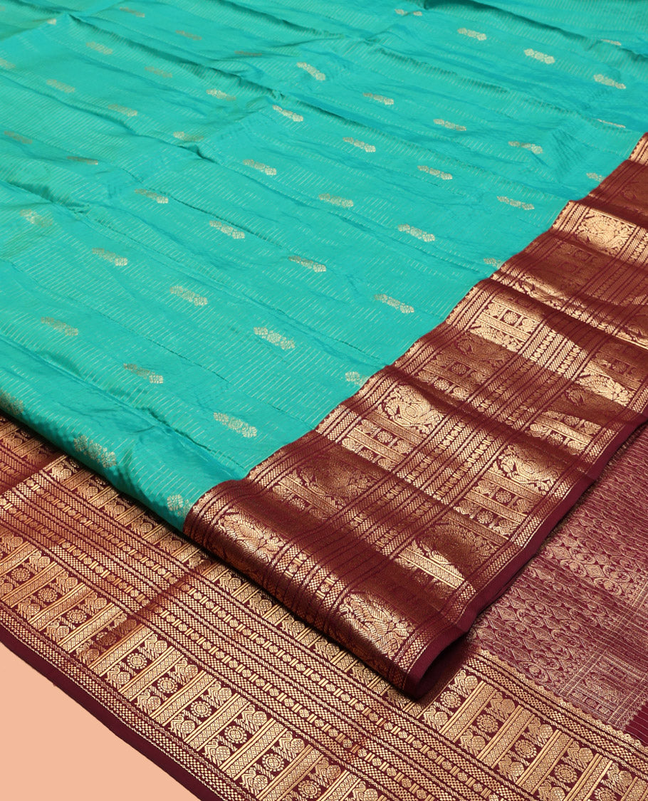 Green Vasundhara Lite Silk Mix Saree, Decked Up with Buttas and Stripes, Complemented by a Contrast Border of Bentex, Mayil Kann, Mayil, and Chakra, Intricate Pallu, and a Contrast Blouse