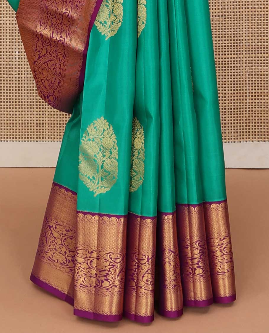 Turquoise blue zari buttas silk saree, contrast border of traditional zari designs, and jaal pallu