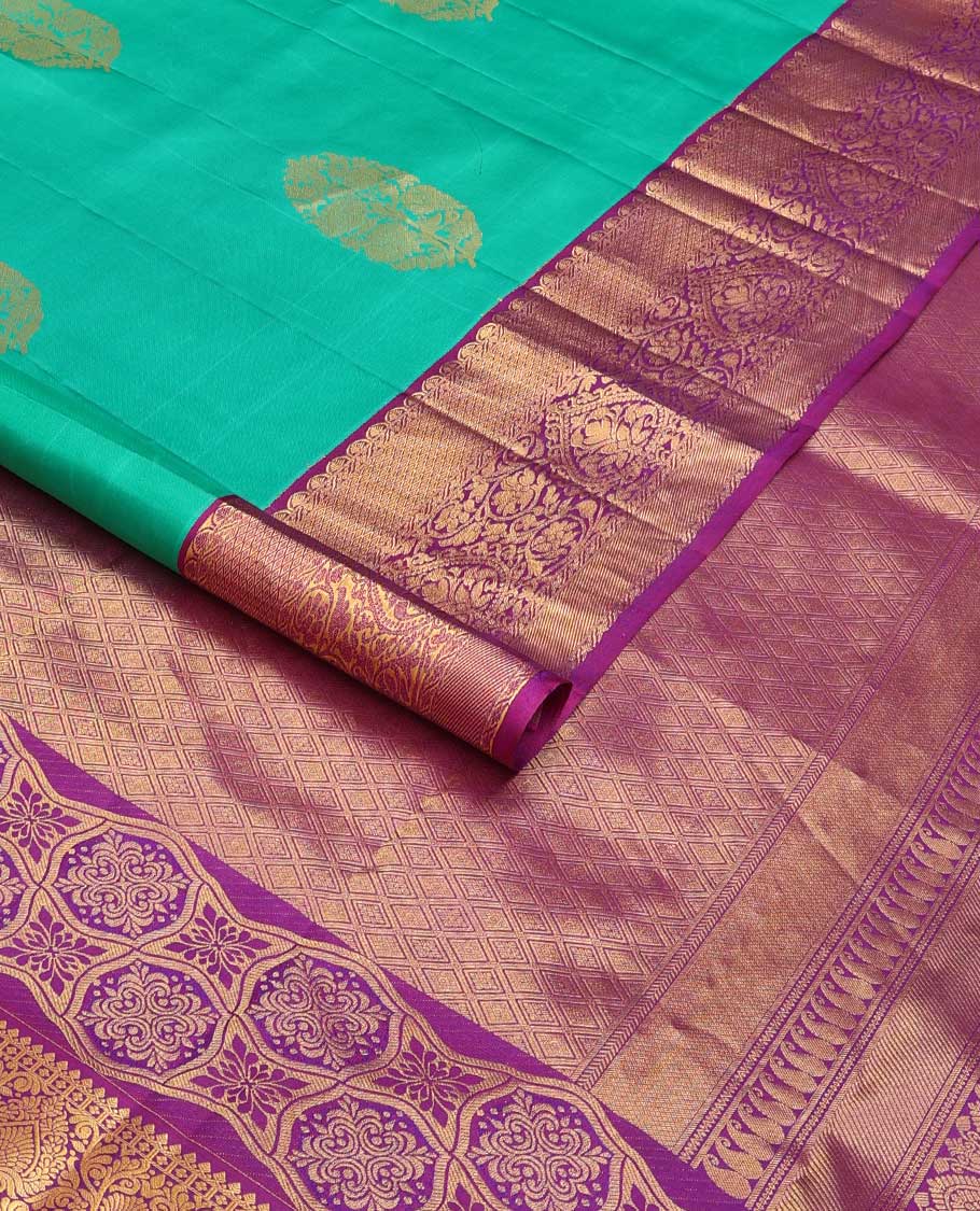 Turquoise blue zari buttas silk saree, contrast border of traditional zari designs, and jaal pallu