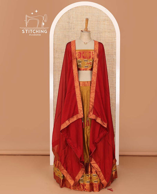 Mustard lehenga set, contrast traditional zari, and ikkat border skirt, matching blouse, and contrast zari bordered plain dhavani