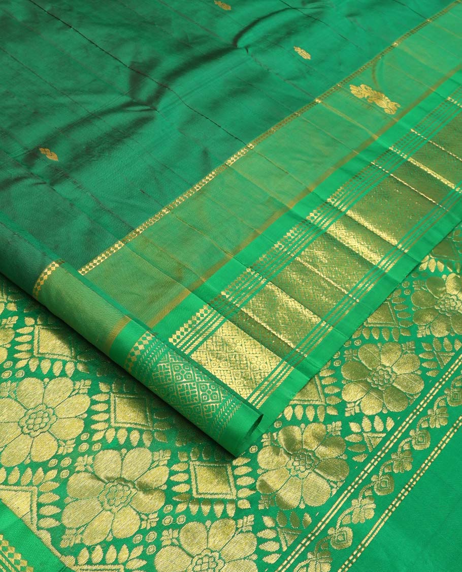 Green zari buttas Kanchipuram silk saree, contrast one-sided border of paneer sombu, banaras, muthu, and jaal designs, and floral-geometric pallu