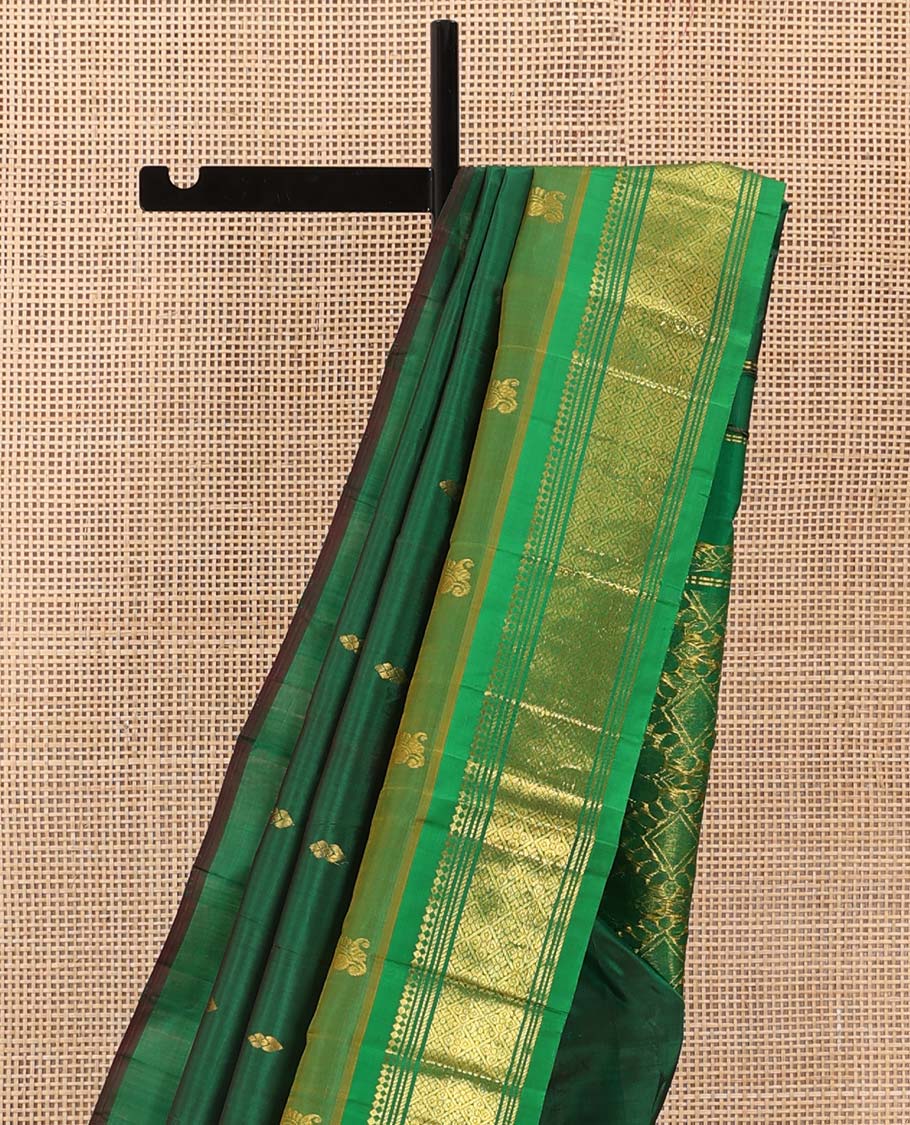 Green zari buttas Kanchipuram silk saree, contrast one-sided border of paneer sombu, banaras, muthu, and jaal designs, and floral-geometric pallu