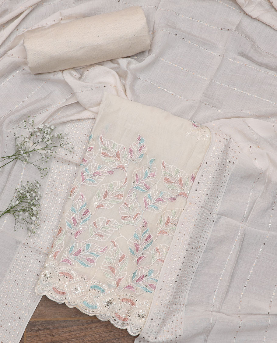 Cream material churidar set, leaf motifs embroidered top, plain bottom, and a sequins embroidered dupatta