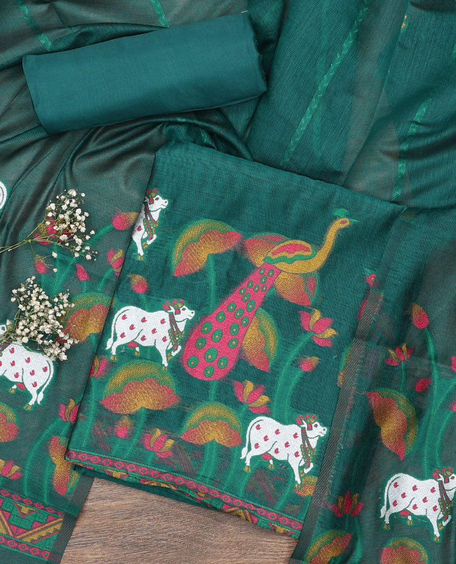 Green material chudidar set, hand-painting style Pichwai lotus, cow and peacock printed top, plain bottom and dupatta mirrors the same top print