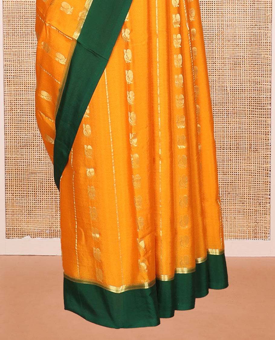 Orange Mysore Silk Saree, Embellished with Peacock Buttas and Stripes Across Its Body, Complemented by Contrast Border, Pallu Steeped with Traditional Zari Designs, and Paired with a Contrast Blouse