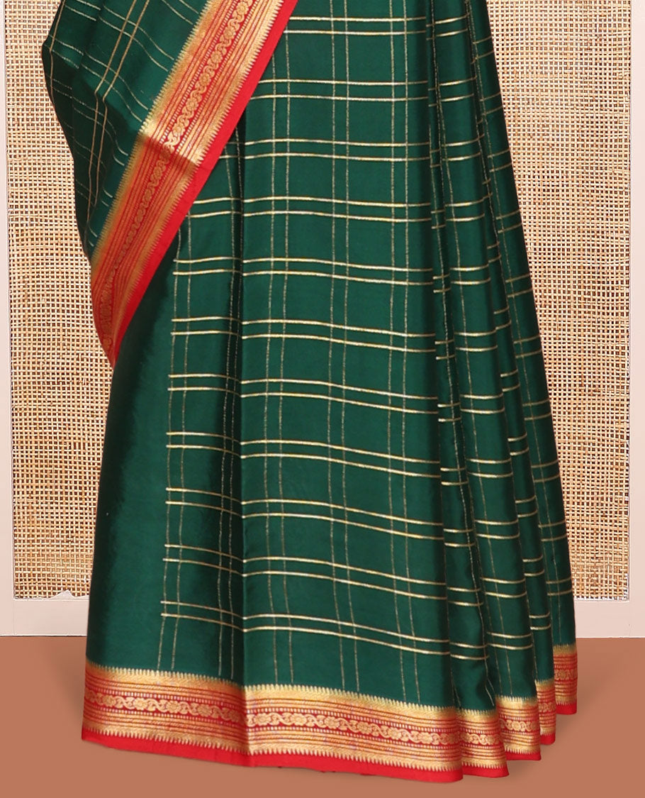 Green Mysore Silk Saree, Gleamed up with Zari Checked Design on its Body, Complemented by Captivating Contrast Border of Traditional Zari Designs, Pallu of Tropical Flora and Flamingo Bird Designs, and Paired with a Contrast Blouse