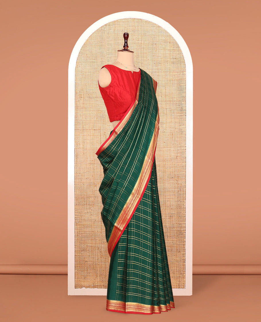 Green Mysore Silk Saree, Gleamed up with Zari Checked Design on its Body, Complemented by Captivating Contrast Border of Traditional Zari Designs, Pallu of Tropical Flora and Flamingo Bird Designs, and Paired with a Contrast Blouse