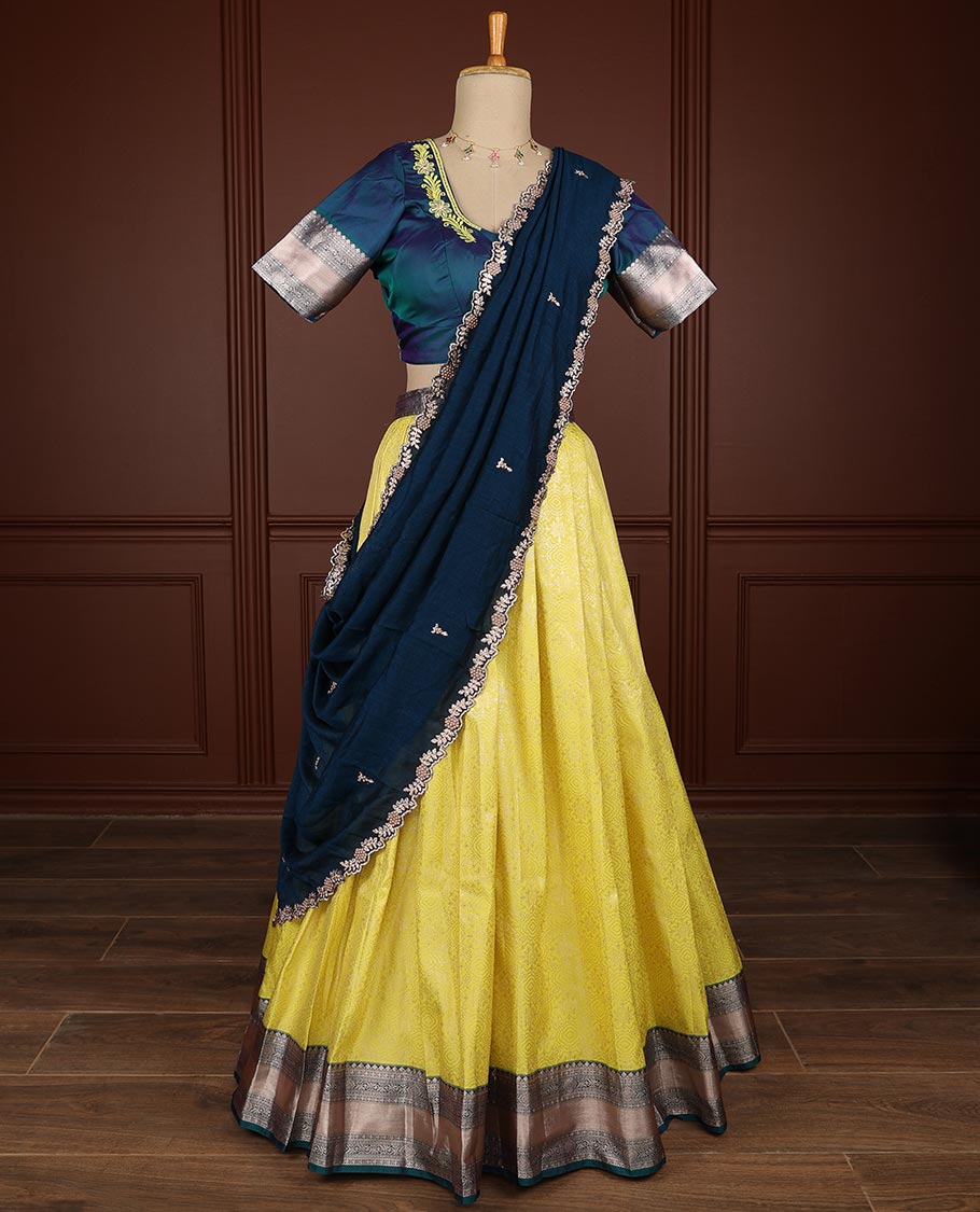 Yellow geometric design half saree witn contrast zari design border, floral embroidery blouse & floral embroidery dhavani