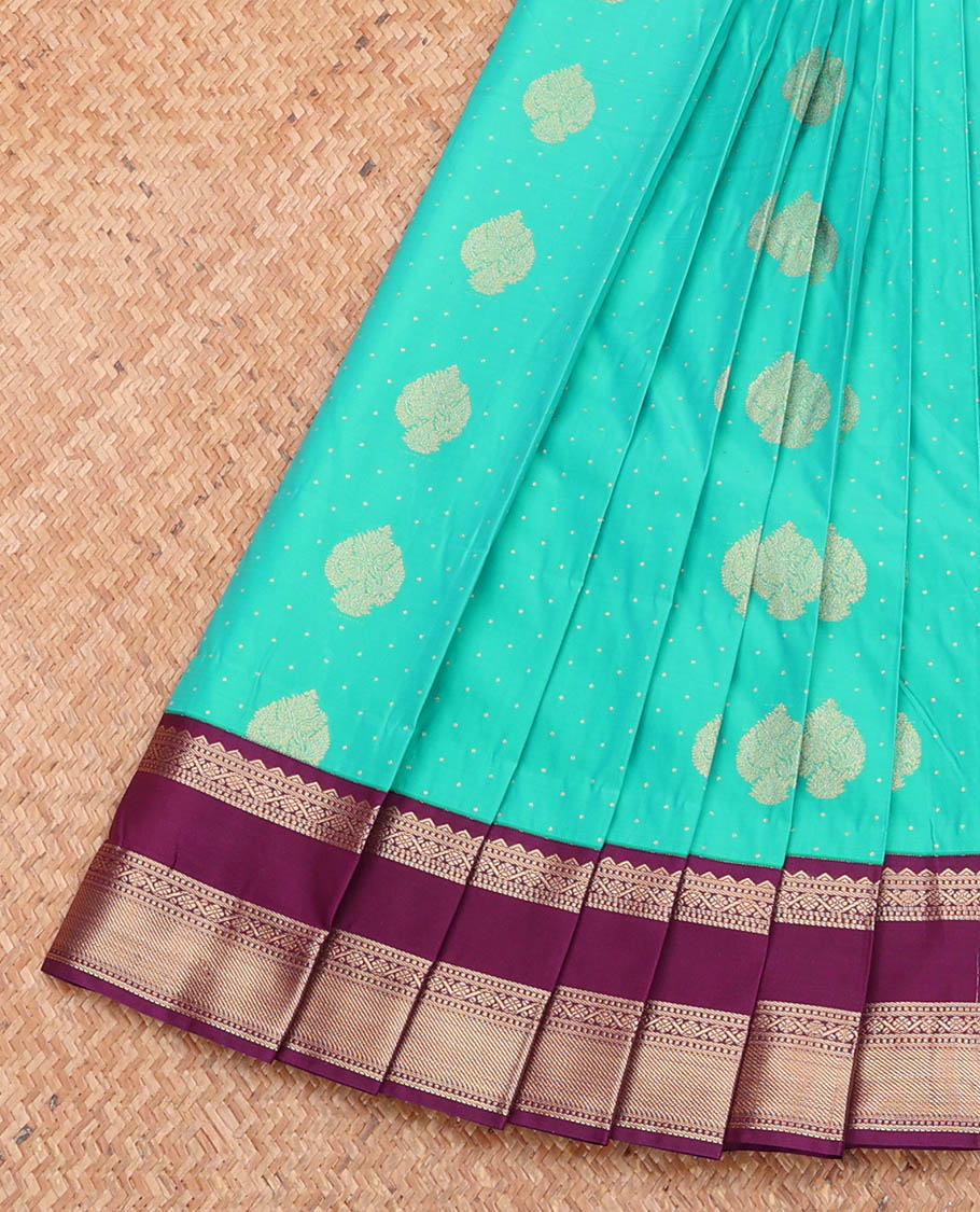 Turquoise Budget Silk Saree Featuring Zari Buttas, Complemented by a Contrast Traditional Zari Design Rettai Pettu Border, Grand Pallu, and a Contrast Blouse