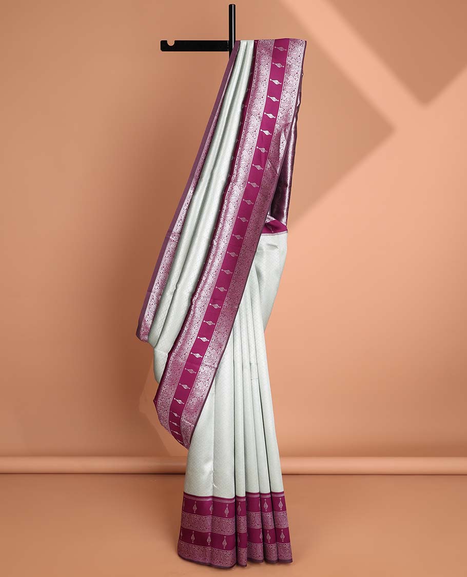 Mint green floral jacquard litchi silk saree with contrast zari design border & checked floral design pallu
