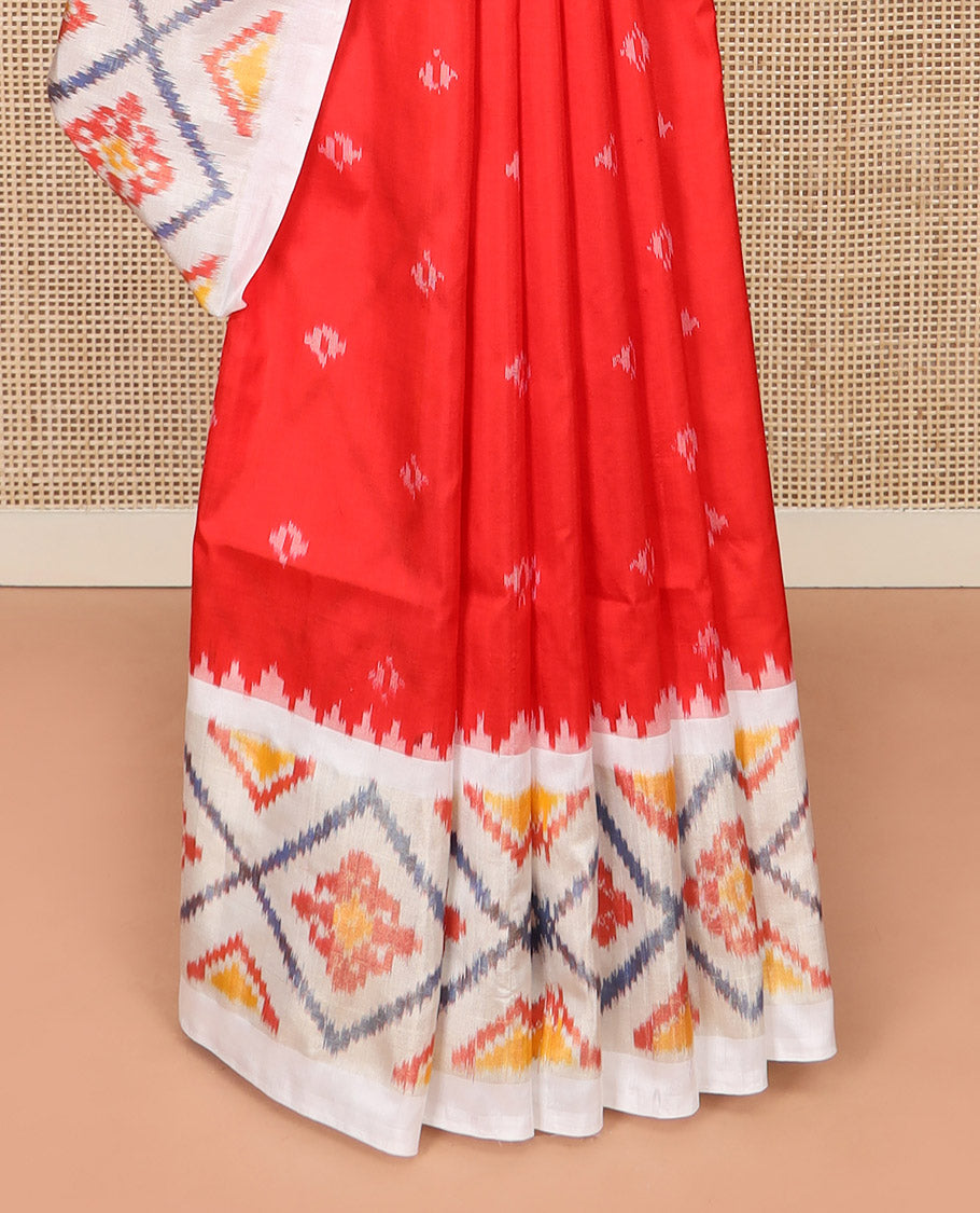 Red Ikkat Silk Saree with Ikkat Buttas, Accentuated with a Contrast Ikkat Jaal-Patterned Border, Pallu Features Ikkat Jaal Patterns, and with a Contrast Blouse