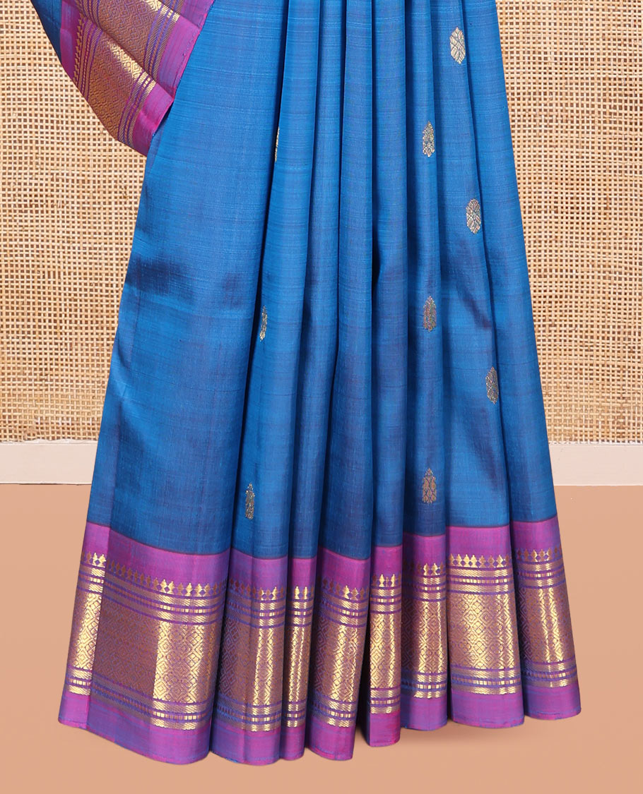 Blue Kanchipuram Silk Saree, Woven with Zari Buttas, a Contrast One-Sided Border of Panner Sombu, Banaras, Muthu, and Jaal Designs, Zari Design Pallu, and a No Blouse