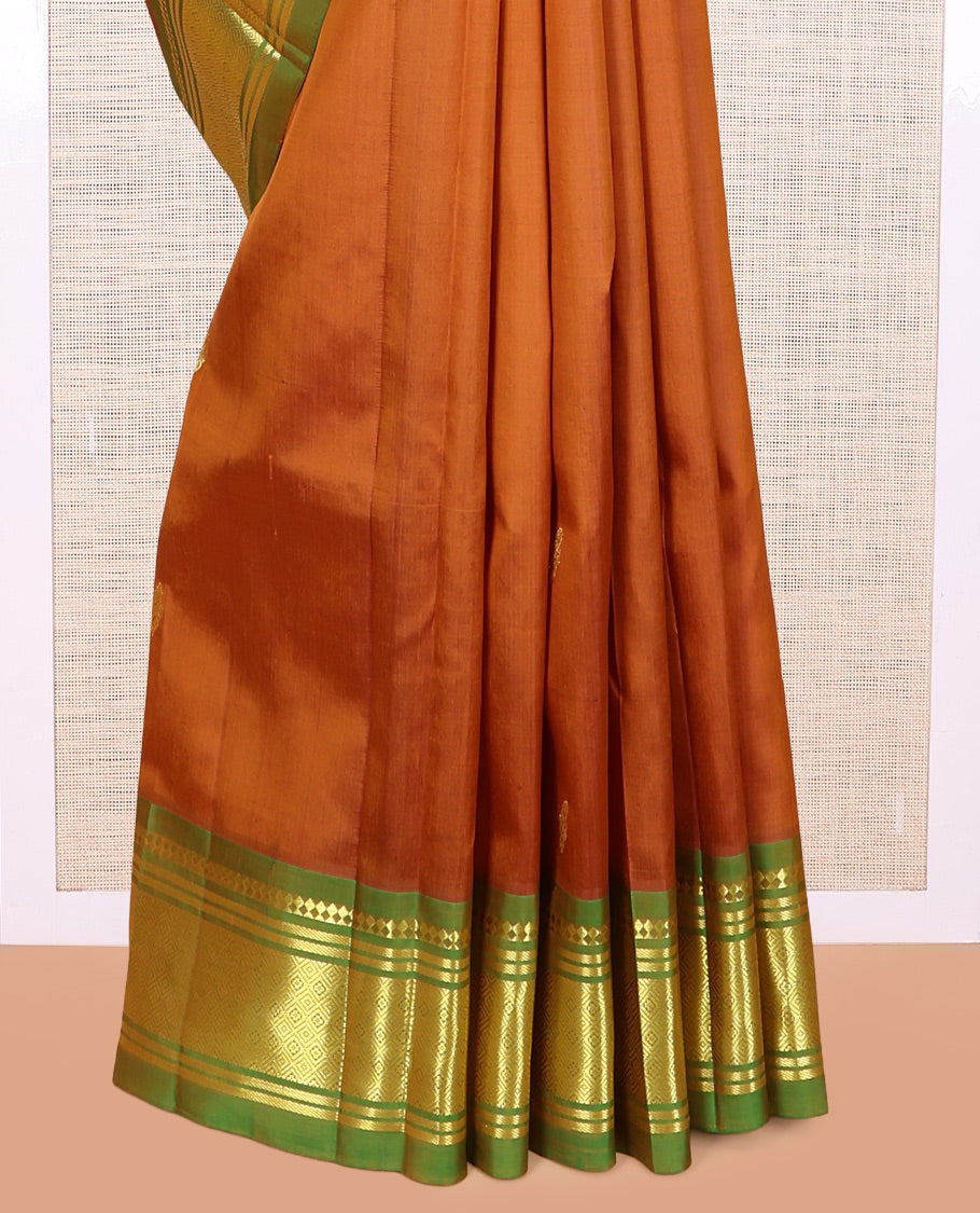 Brown Kanchipuram Silk Saree, Beautified with Zari Buttas, a Contrast One-sided Border of Panner Sombu, Banaras, and Jaal Designs, Pallu of Floral Designs, and No Blouse