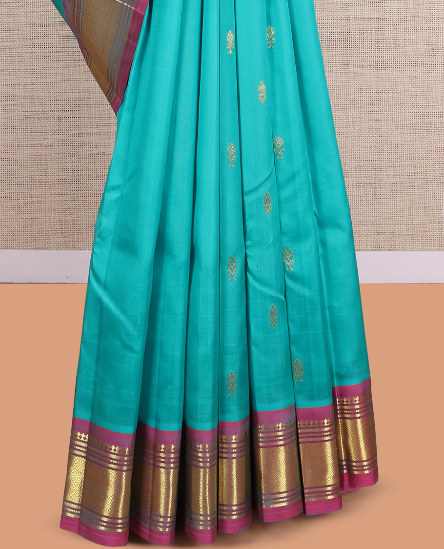 Blue Kanchipuram Silk Saree, Ornamented with Zari Buttas, a Contrast One-Sided Border of Paneer Sombu, Banaras, Muthu and Jaal Design, Zari Design Pallu, and No Blouse