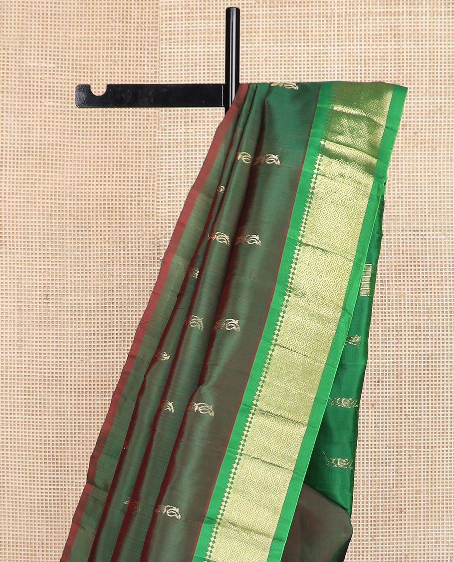 Green zari buttas Kanchipuram silk saree, contrast one-sided border of paneer sombu, kathir, and mayil kann, and zari design pallu