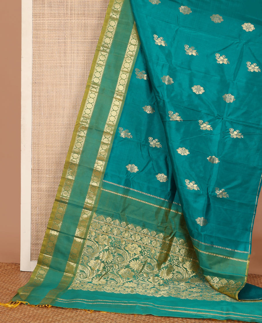 Green zari buttas Kanchipuram silk saree, contrast one-sided rettai pettu border of rekku, and laddu kamalam, and floral design pallu