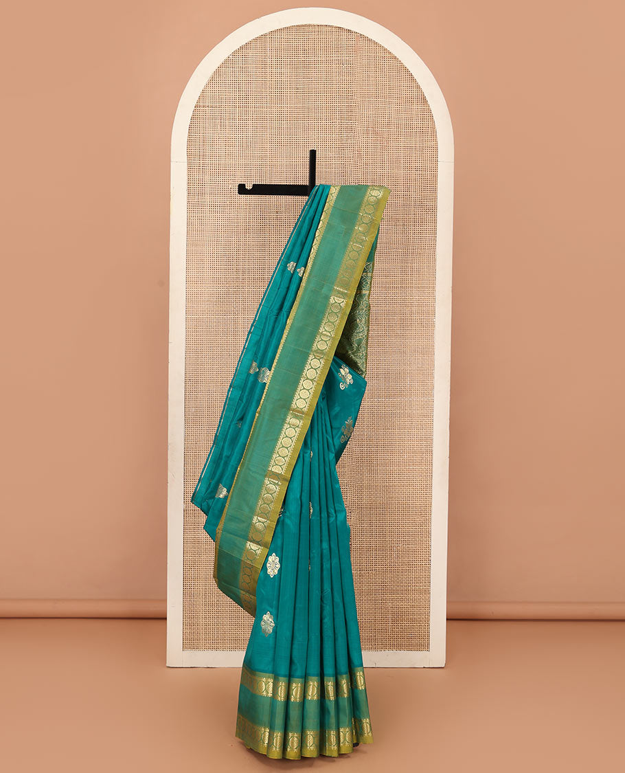 Green zari buttas Kanchipuram silk saree, contrast one-sided rettai pettu border of rekku, and laddu kamalam, and floral design pallu