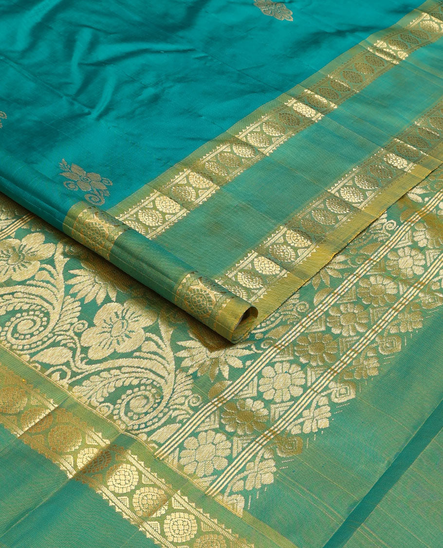 Green zari buttas Kanchipuram silk saree, contrast one-sided rettai pettu border of rekku, and laddu kamalam, and floral design pallu