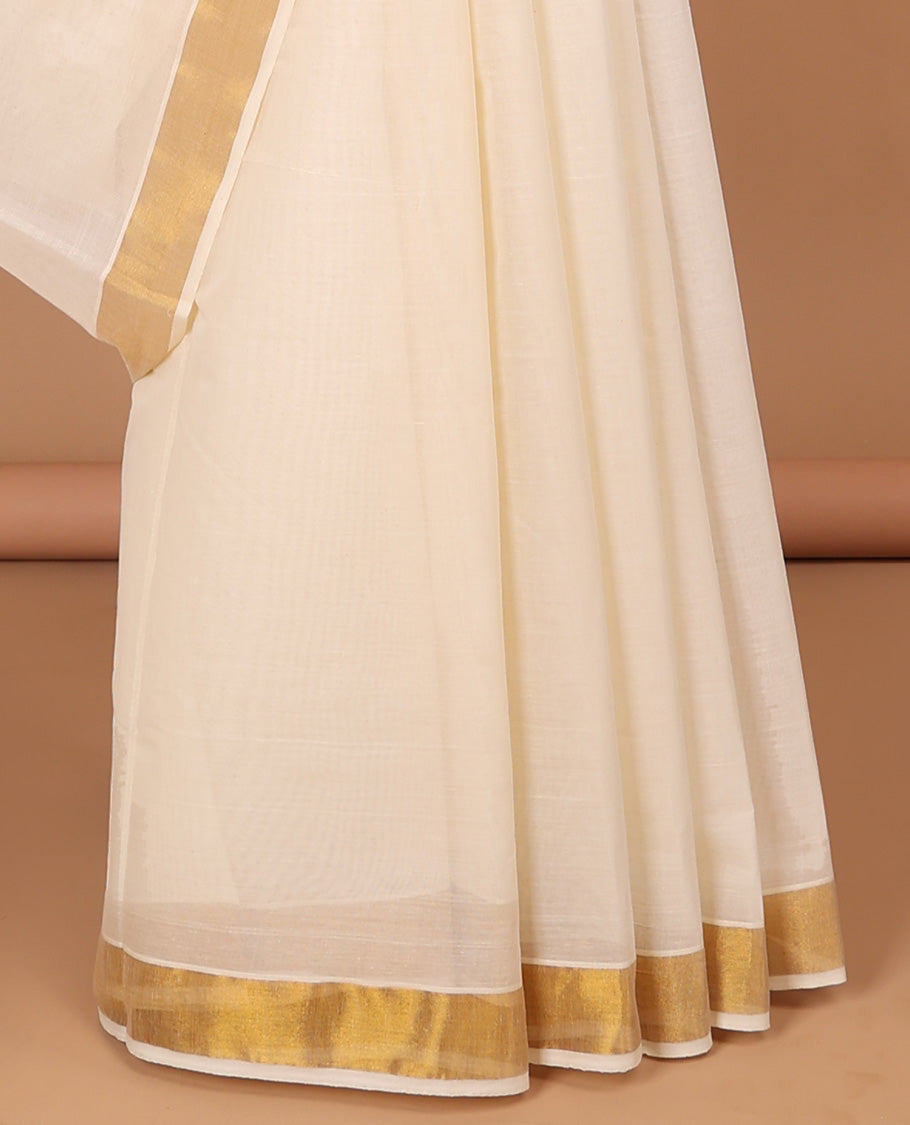 Cream kerala saree with zari stripes, zari border & pallu of intricate designs