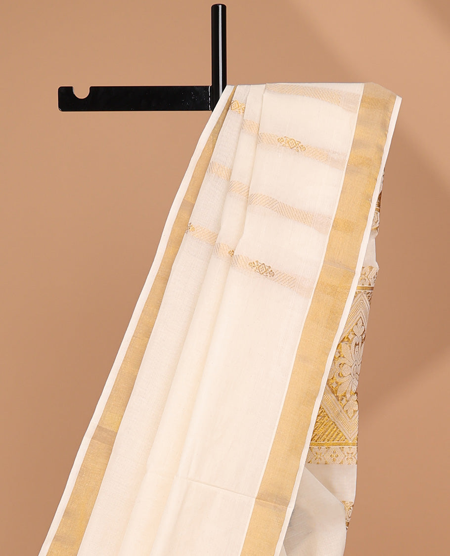 Cream kerala saree with zari stripes, zari border & pallu of intricate designs