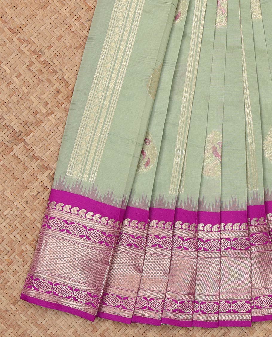 Pista Green Litchi Saree, Enriched with Zari Buttas and Stripes, a Contrast Traditional Zari Border, a Grand Pallu, and a Contrast Blouse