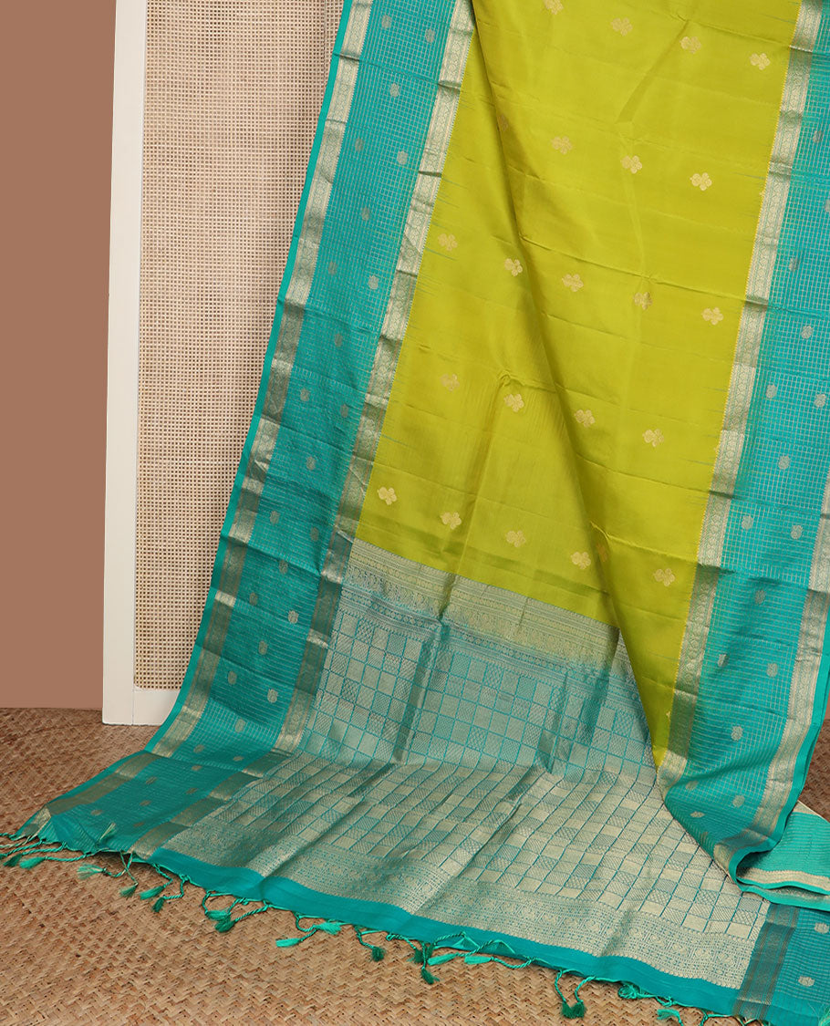 Parrot green zari buttas soft silk saree, contrast zari checked border of thilakam, banaras, mayil kann & mayil designs & geometric motifs enclosed checked pallu