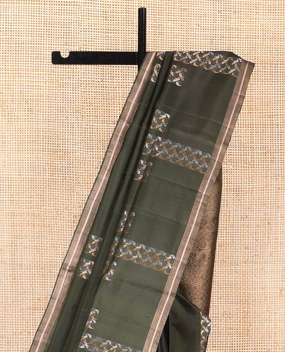 Green Mayuri Soft Silk Saree, Steeped in Richness with Paisley Buttas on Its Body, Subtle Zari Piping Border, Pallu of Jaal Designs, and Paired with Matching Blouse