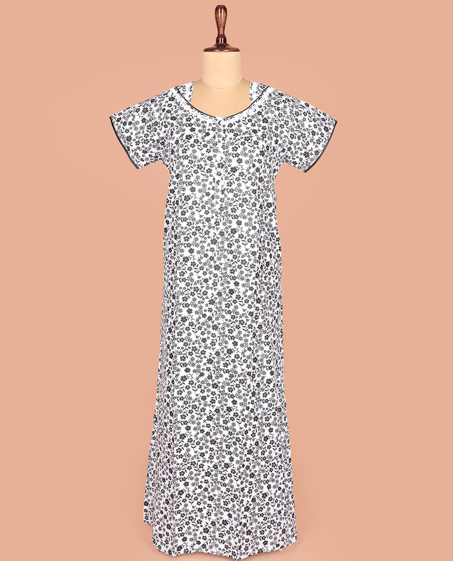 White Cotton Nighty Adorned with Floral Motifs Print, Featuring Neck Lace Work, Unique Front Neck, and Half Sleeves