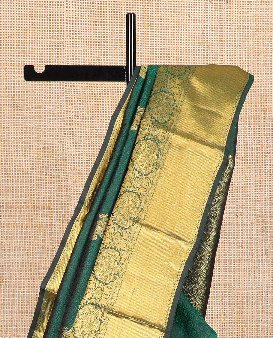 Dark green embossed & mayil buttas silk saree, self-border of thilakam mokku, muthu, poun, banaras design & jaal pallu