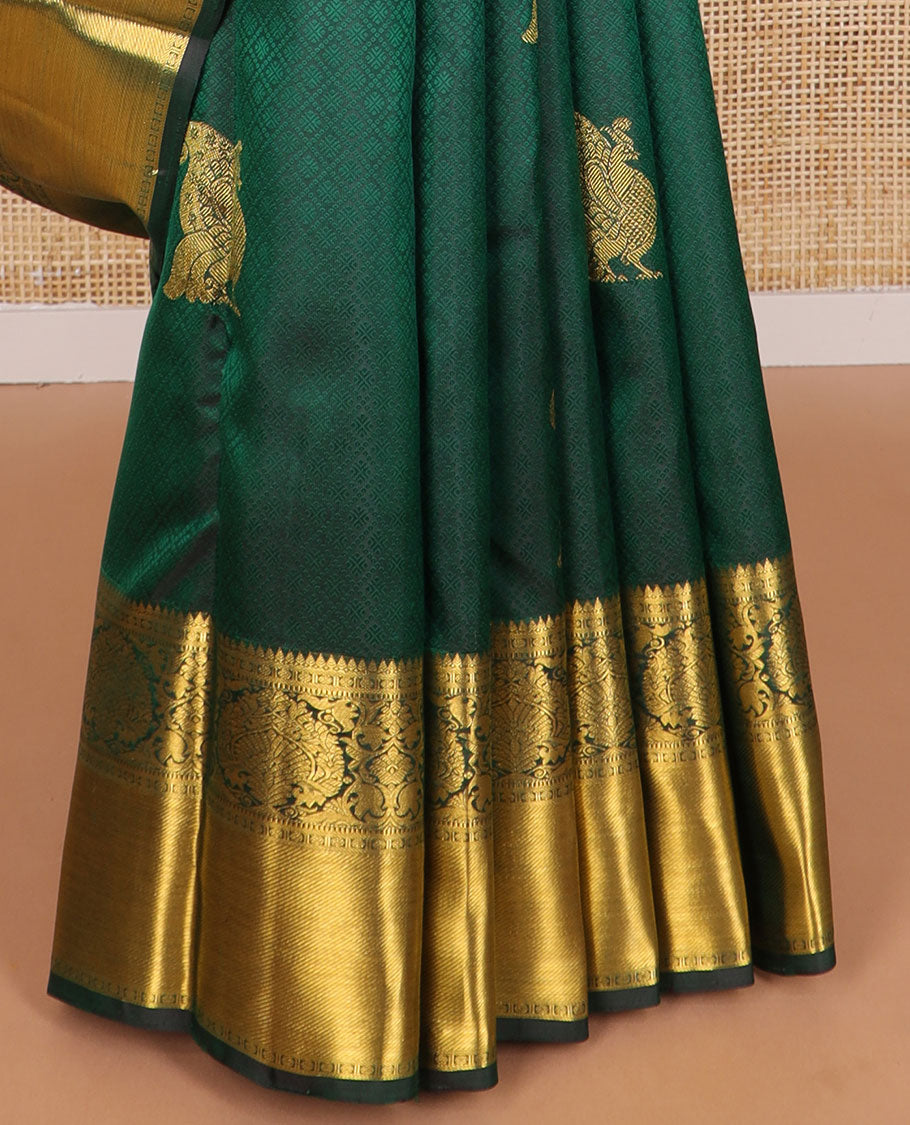 Dark green embossed & mayil buttas silk saree, self-border of thilakam mokku, muthu, poun, banaras design & jaal pallu