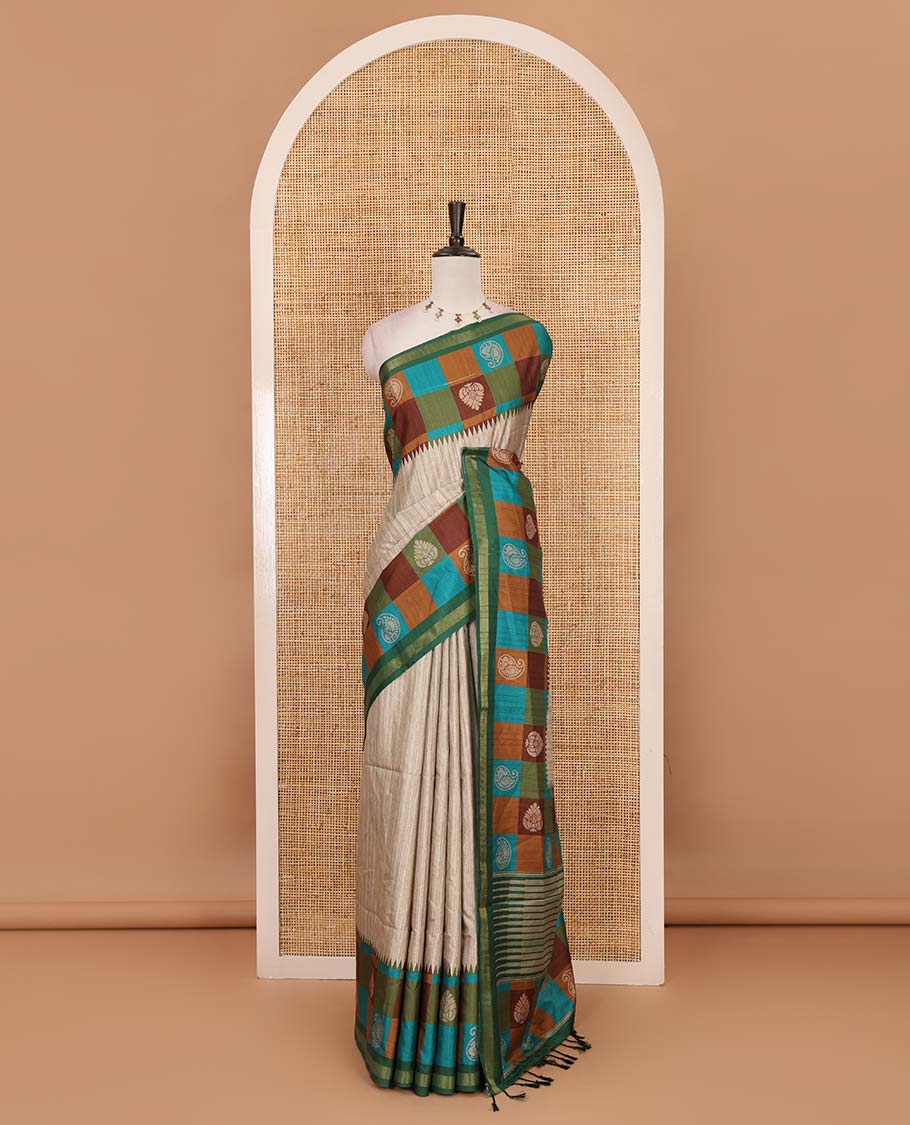 Chikku-Green plain kathan silk saree, contrast buttas enclosed multi-color checked blocks border, temple pallu, and contrast blouse of checks, and buttas