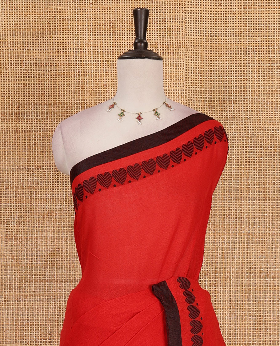 Red plain khadi cotton saree with contrast border and plain pallu with tussels