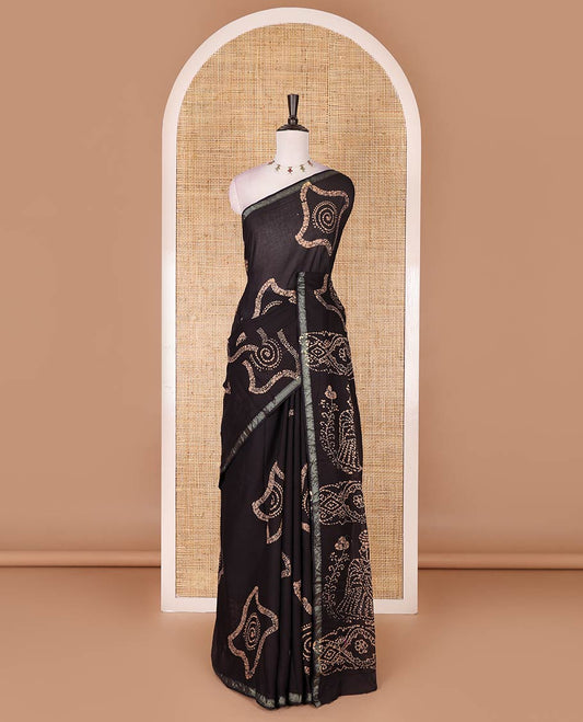 Black-chikku batik geometric printed pure cotton saree, zari piping border, human figurines batik printed pallu, and a matching batik printed blouse