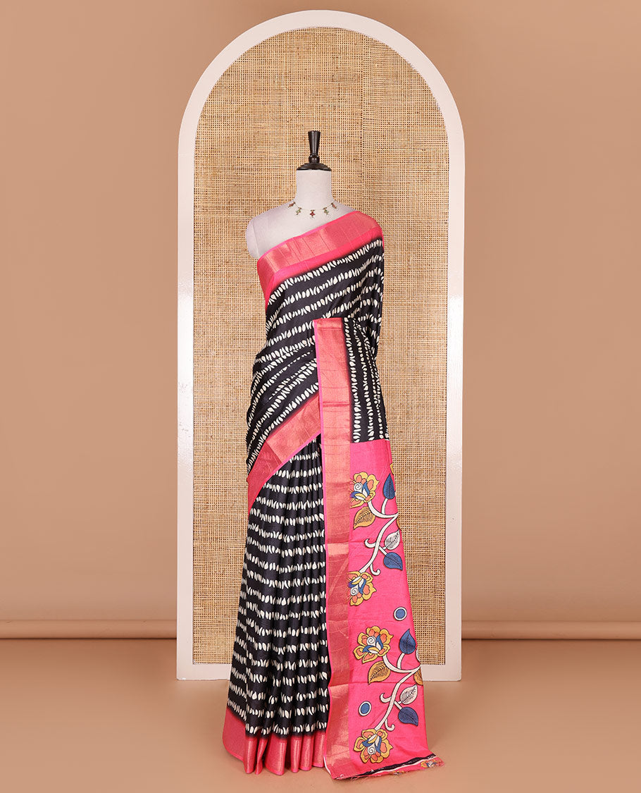 Black geometric patterns printed soft tussar saree, contrast bavanji border, kalamkari floral vine printed pallu, and printed blouse