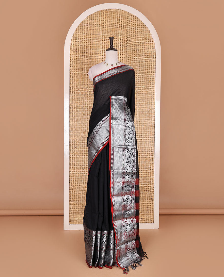 Black plain mercerised cotton saree, contrast traditional zari border of elephant and peacock designs, striped pallu, and plain blouse