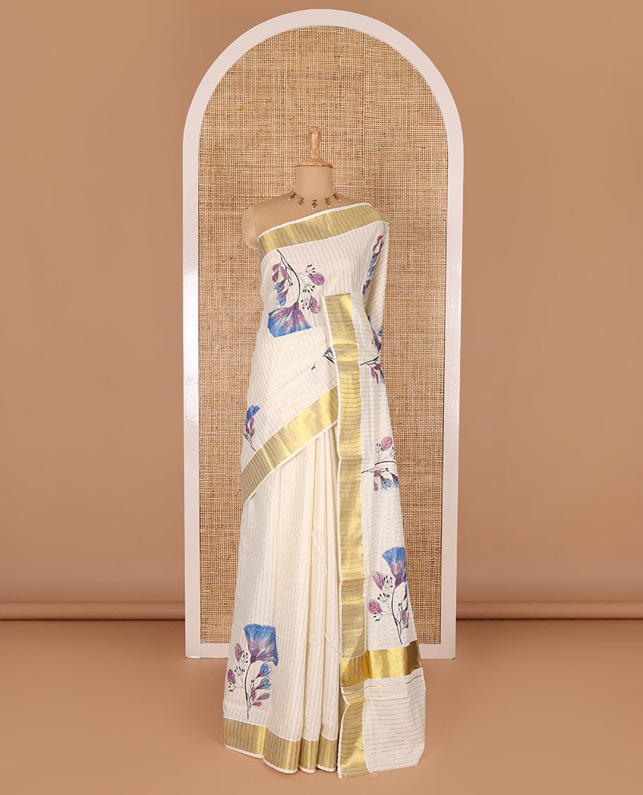 Cream and blue vertically striped with handblock floral motifs printed Kerala cotton saree, zari striped border, handblock floral printed pallu, and a matching blouse