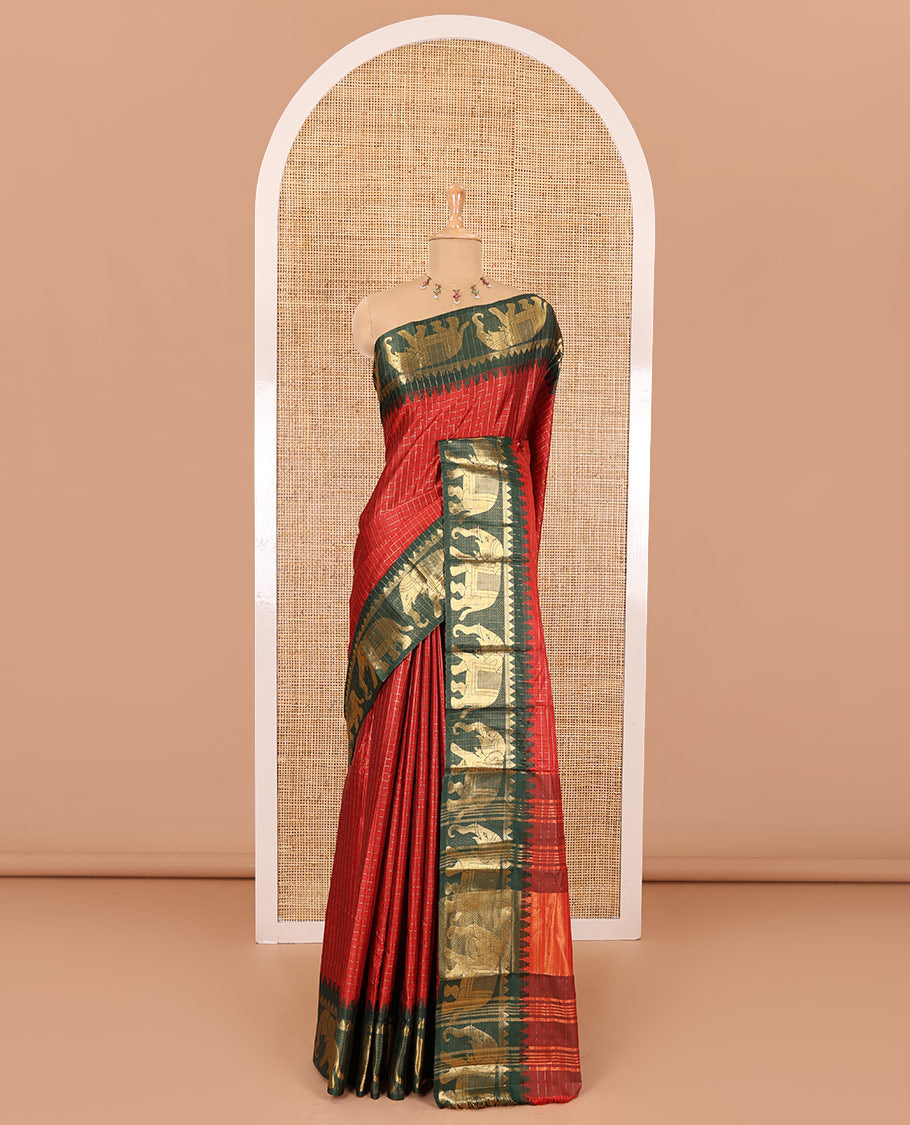 Maroon zari checked semi-taffeta saree, contrast satin temple border of elephant motifs, striped pallu, and a contrast striped blouse