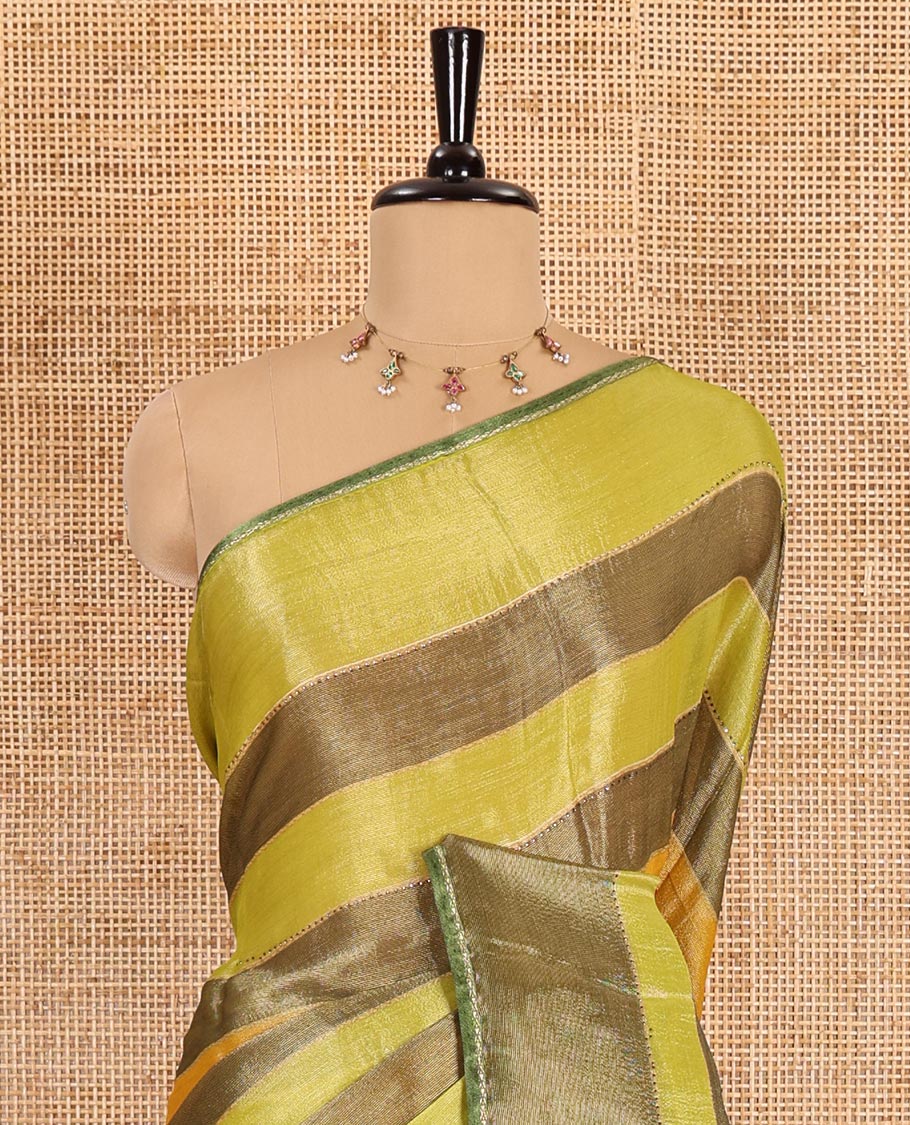 Green horizontal striped fendy chiffon saree, piping border, striped palu, and blouse of sequins and zari buttas