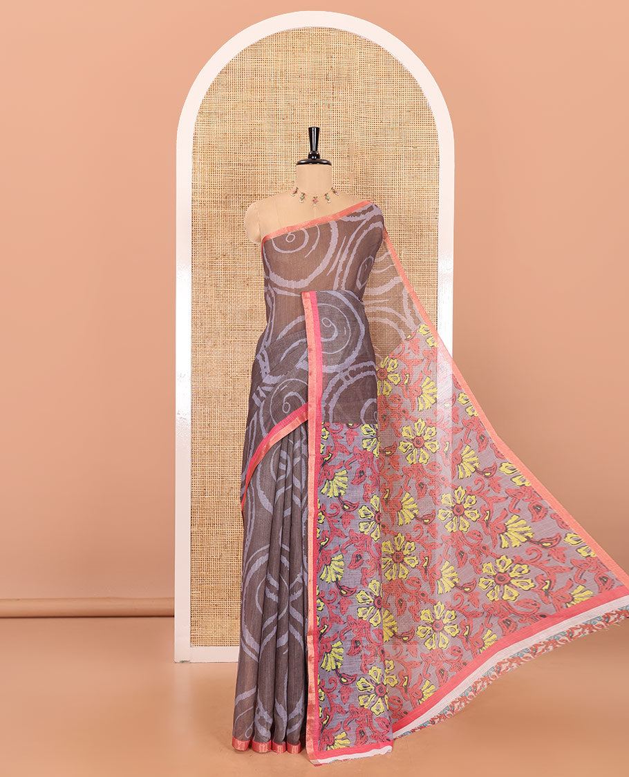 Olive green spiral batik printed linen cotton saree, contrast piping border, floral printed pallu, and a contrast floral printed blouse