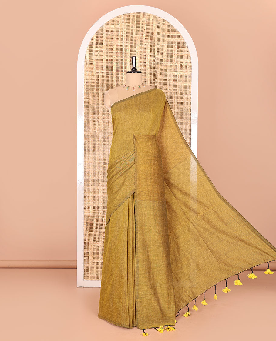 Borderless Mustard Plain Khadi Mul Cotton Saree Featuring a Self Pallu with Tassels, Paired with a Matching Plain Blouse