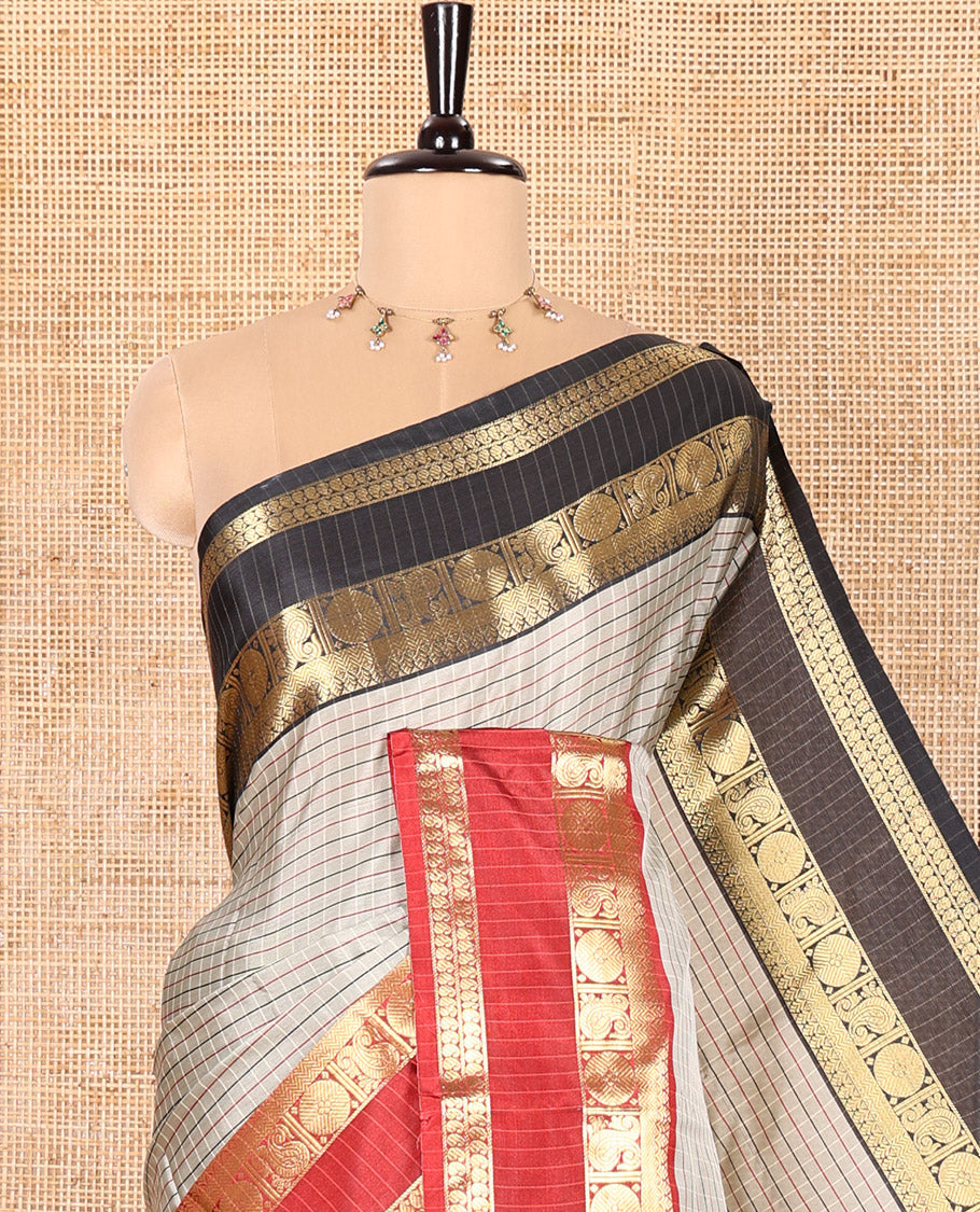 Grey Semi-Soft Silk Saree Accentuated with Micro-Checks on Its Body, Complemented by a Contrast Rettai Pettu Zari Border of Paisley, and Chakram Designs, Subtly Striped Pallu, and Paired with a Contrast Blouse