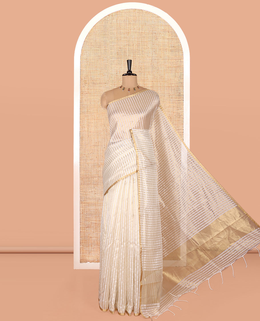 Borderless Off-white Tissue Saree, Richly Detailed with Vertical Golden Zari Stripes All Over Its Body, Highlighted by Gleaming Zari Striped Pallu, and Paired with a Matching Blouse