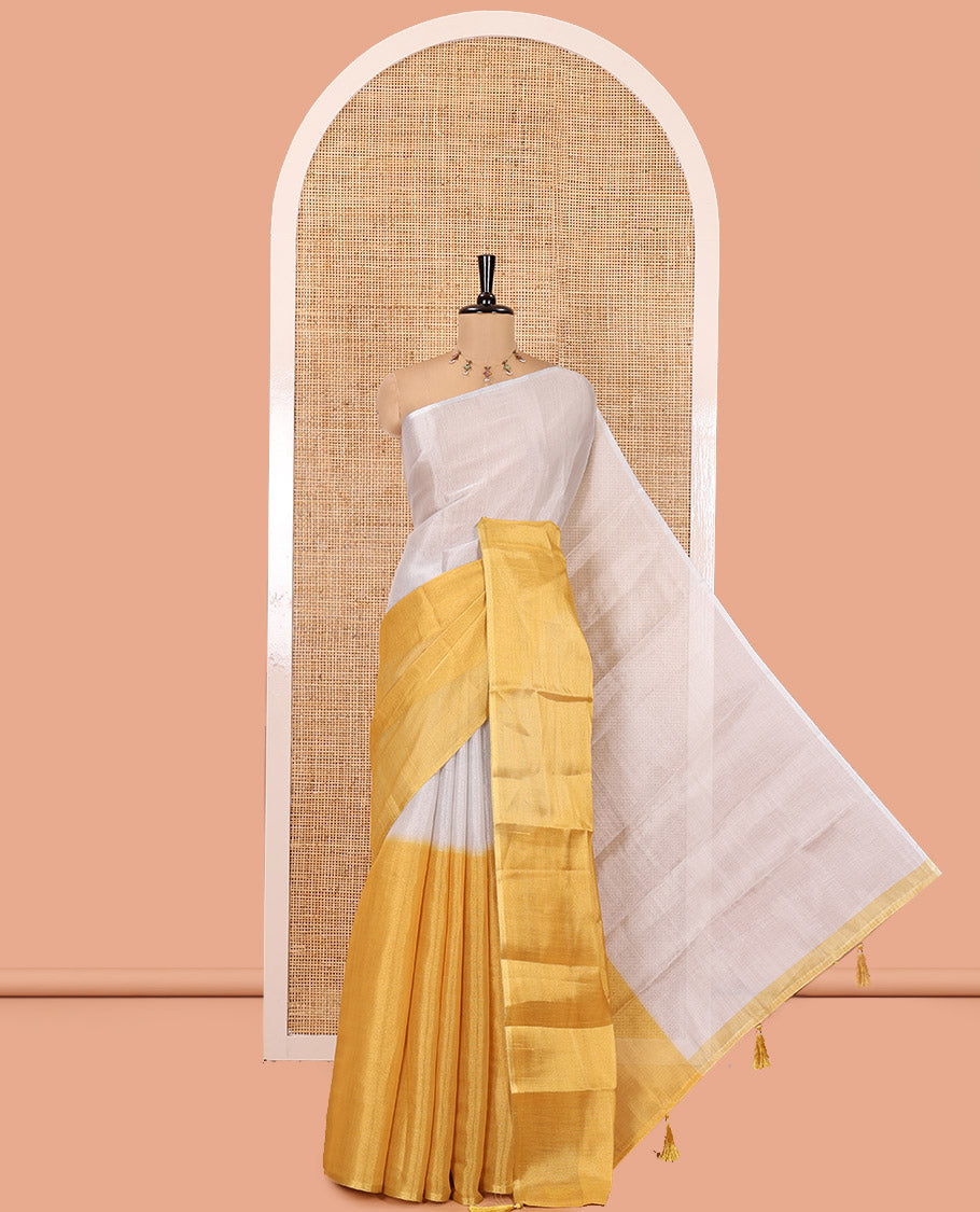 Borderless Yellow Plain Tissue Saree, a Self-Pallu with Tassels, and a Matching Blouse