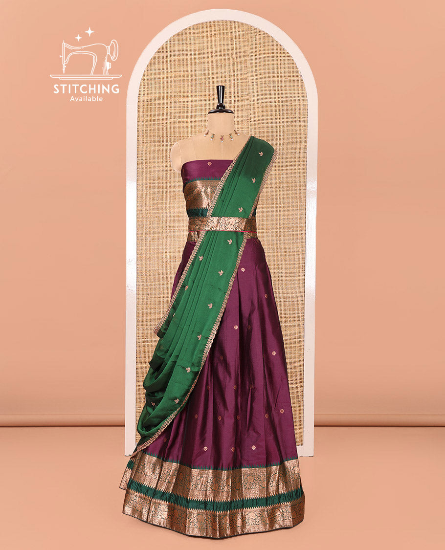 Purple-Green Semi-Banarasi Half-Saree Featuring Zari Buttas on Its Skirt, Complemented by a Contrast Traditional Zari Temple Rettai Pettu Border, Paired with a Matching Blouse, and a Satin Georgette Embroidered Scallop Dhavani