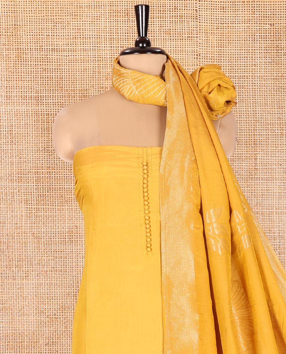 Yellow Semi-Silk Material Chudidar Set, Adorned with Pom-Pom Necklined Top, a Plain Santoon Bottom, and Paired Floral Zari Woven Semi-Silk Dupatta