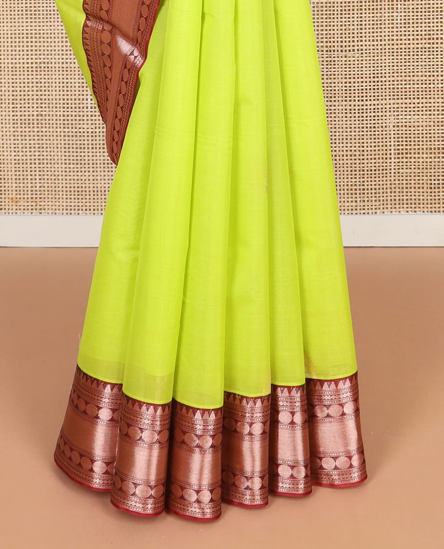 Light green motifs silk cotton saree with contrast zari design border & peacock design, striped pallu
